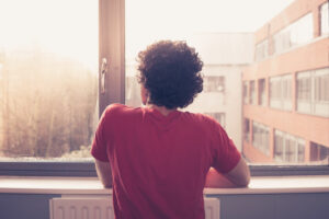 man at window